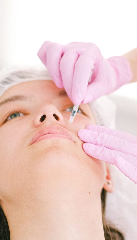 Client receiving a dermal filler treatment in clinic