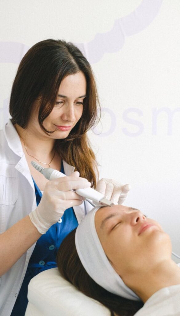 Specialist preparing HIFU treatment areas for a client